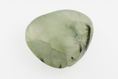 natural green prehnite gem on white backgroundの写真素材