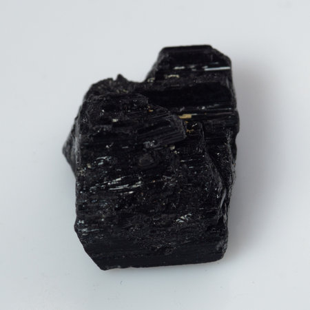 natural black tourmaline scherl on white background