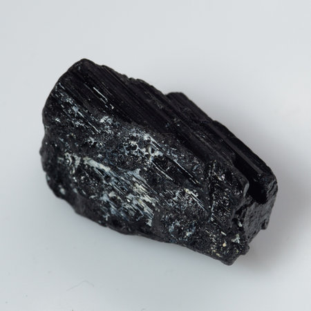 natural black tourmaline scherl on white background