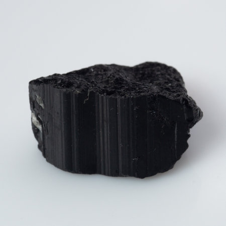 natural black tourmaline scherl on white background