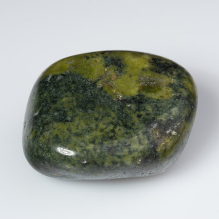 Green Serpentine Gemstone Against a White Background.