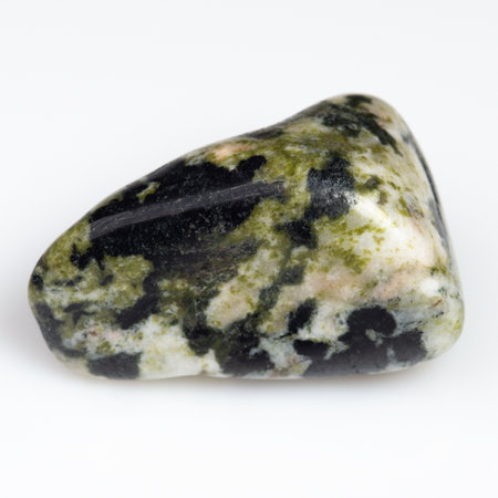 Exquisite Close-up of Polished Serpentine Gemstone on Pristine White Background.の写真素材