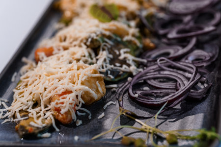 Exquisite Gourmet Pasta with Fresh Vegetables and Grated Cheese on Elegant Serving Platter.
