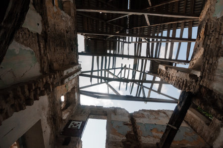 A Glimpse into Abandonment: The Weathered Remnants of a Forgotten Structure.の写真素材