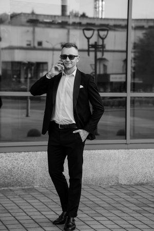 A Stylish Businessman in a Sharp Suit Against a City Backdrop.