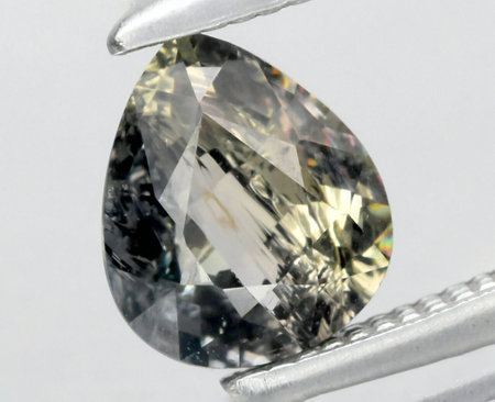 Exquisite Pear-Shape Natural Multicolored Gemstone Displaying Intricate Facets and Radiant Sparkle.