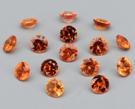 Splendid Display of Natural Orange Gemstones Gleaming Under Soft Light.