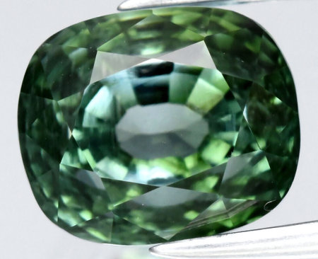 Exquisite Green Sapphire Gemstone with Intricate Faceting.の写真素材