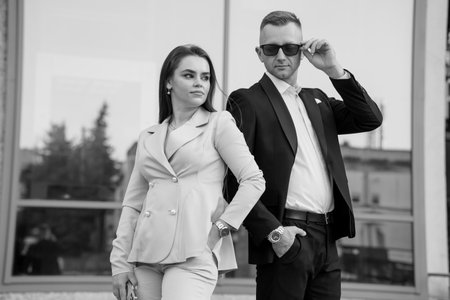 Elegant Monochrome Portrait of a Stylish Couple in Urban Setting.の写真素材