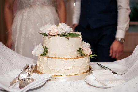 Elegant Wedding Cake with Floral Accents and Romantic Ambiance.の写真素材