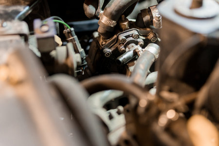 Close-Up of an Automotive Engine Component in a Workshop Environment.