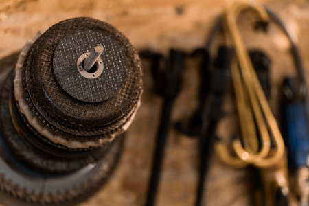 A Close-Up View of Stacked Weight Plates and Various Fitness Equipment.