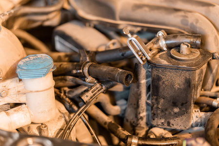 Detailed Close-Up of a Car Engine with Various Components and Hoses.の写真素材