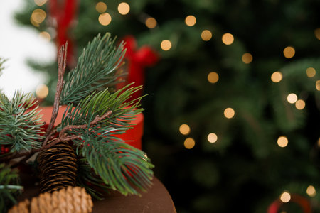 Festive Holiday Decor with Pine Branches and Soft Bokeh Lights.