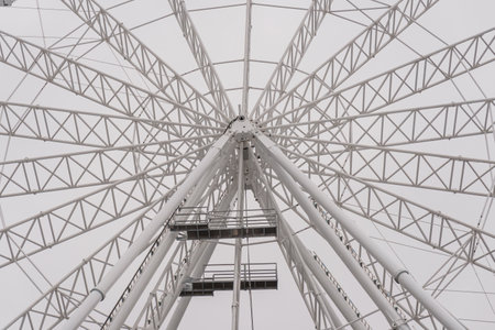 Underneath the Spectacular Ferris Wheel Structure Against a Gray Sky.