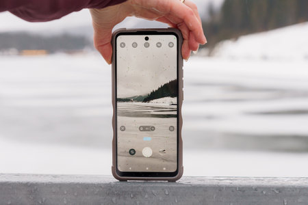 Capturing Winter Serenity: A Smartphone Photography Moment in a Snowy Landscape.