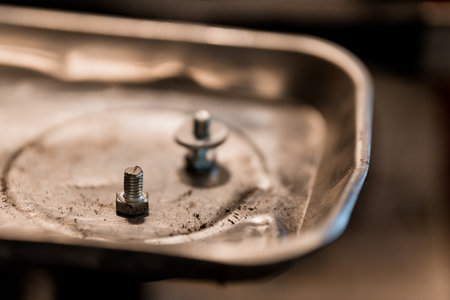 Close-Up of Metal Bolts on a Steel Surface.の写真素材
