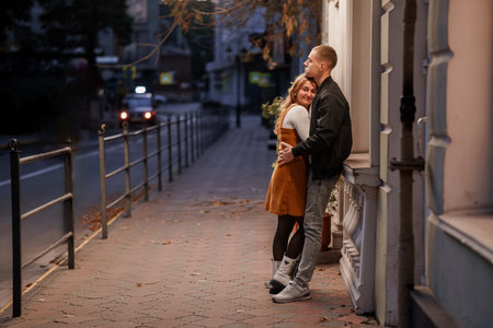 Romantic Evening Embrace on a City Street.の写真素材