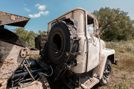 Abandoned Vintage Truck Overgrown in Nature.の写真素材