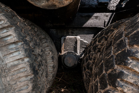 Close-Up View of Machinery Components Beneath Tires.の写真素材