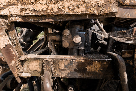 Close-Up of a Rusty Hydraulic Mechanism in a Mud-Covered Machine.の写真素材