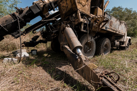 Abandoned Heavy Machinery in Overgrown Landscape.