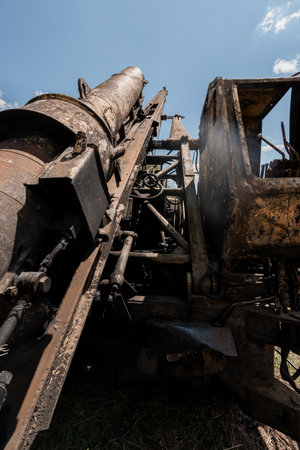 Rusty Excavation Machine Under a Bright Blue Sky.