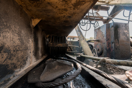 View of a Rusty Underbelly of Industrial Machinery Highlighting Wear and Tear.