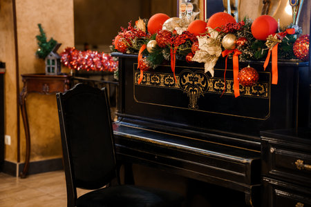 Elegant Christmas Decorated Piano in a Cozy Festive Room.の写真素材