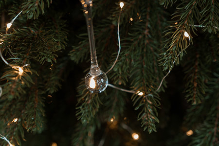 Christmas Tree Decoration with Glass Bauble and Fairy Lights.の写真素材
