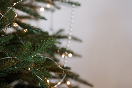 Tranquil Close-Up of a Christmas Tree's Greenery and Fairy Lights.