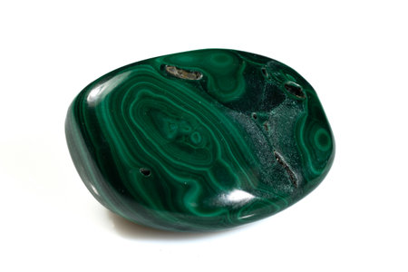 Natural Malachite Stone Displaying Unique Green Banding and Polished Surface.の写真素材