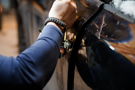 Car Lock Mechanism Being Manipulated by a Skilled Technician.