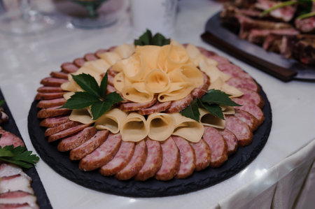 Exquisite Charcuterie Platter Featuring Sliced Meats and Cheeses.の写真素材