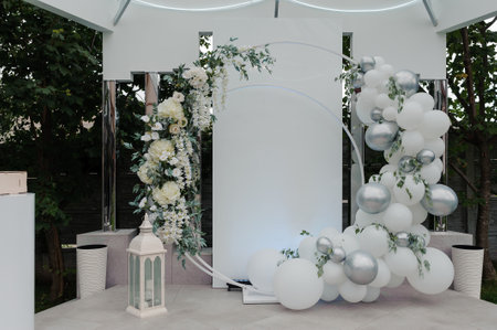 Elegant Wedding Ceremony Backdrop with Floral Arrangements and Balloon Decorations.の写真素材
