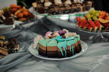 Colorful Dessert Display featuring Layered Cake and Assorted Sweets.