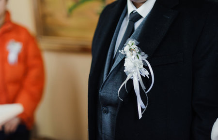 Elegant Groom Attire Featuring a Tasteful Boutonniere.の写真素材
