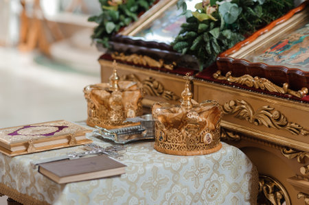 Ornate Golden Crowns on an Altar Surrounded by Religious Icons and Decor.の写真素材