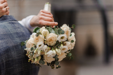 Elegant Wedding Bouquet with Cream Roses and Greenery.の写真素材