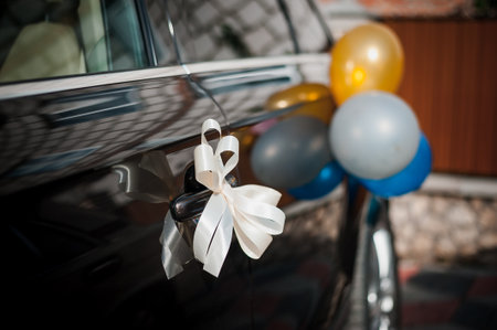 Elegant Wedding Car Decoration with Balloons and Ribbons.の写真素材