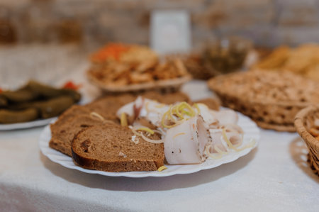 Traditional Appetizer Platter Featuring Slices of Cured Meat and Rye Bread.の写真素材