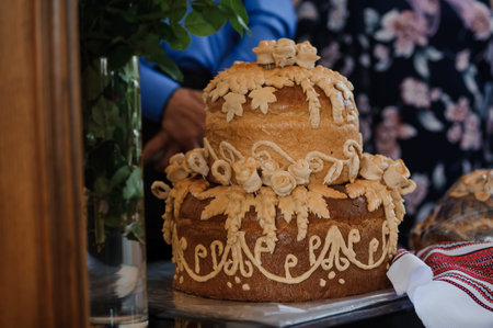 Exquisite Traditional Bread Cake Decorated with Floral and Leaf Designs.の写真素材