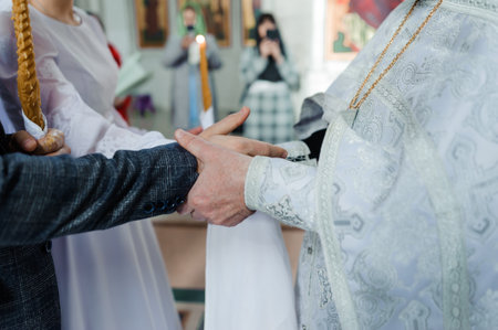 Emotional Wedding Ceremony with Hands Joined in Unity.の写真素材