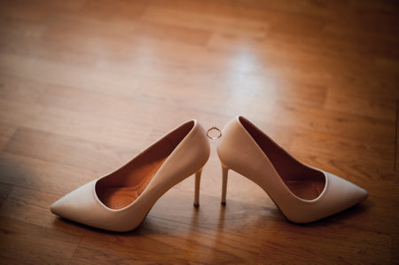 Elegant White High Heels on Wooden Floor.の写真素材