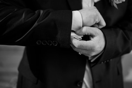 Groom Adjusting Cufflinks Before Wedding Ceremony.の写真素材