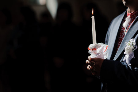 A Solemn Moment: Candlelit Ceremony in Dim Light.