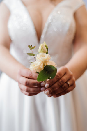 Elegant Bride Holding a Beautiful Floral Bouquet in a Wedding Dress.の写真素材