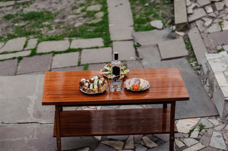 Elegant Outdoor Dining Setup with Artfully Presented Dishes.の写真素材