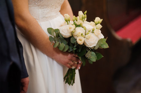 Elegant Bridal Bouquet with White Roses and Eucalyptus in Wedding Ceremony.の写真素材