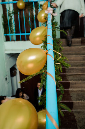 Festive Decor with Golden Balloons and Greenery.の写真素材